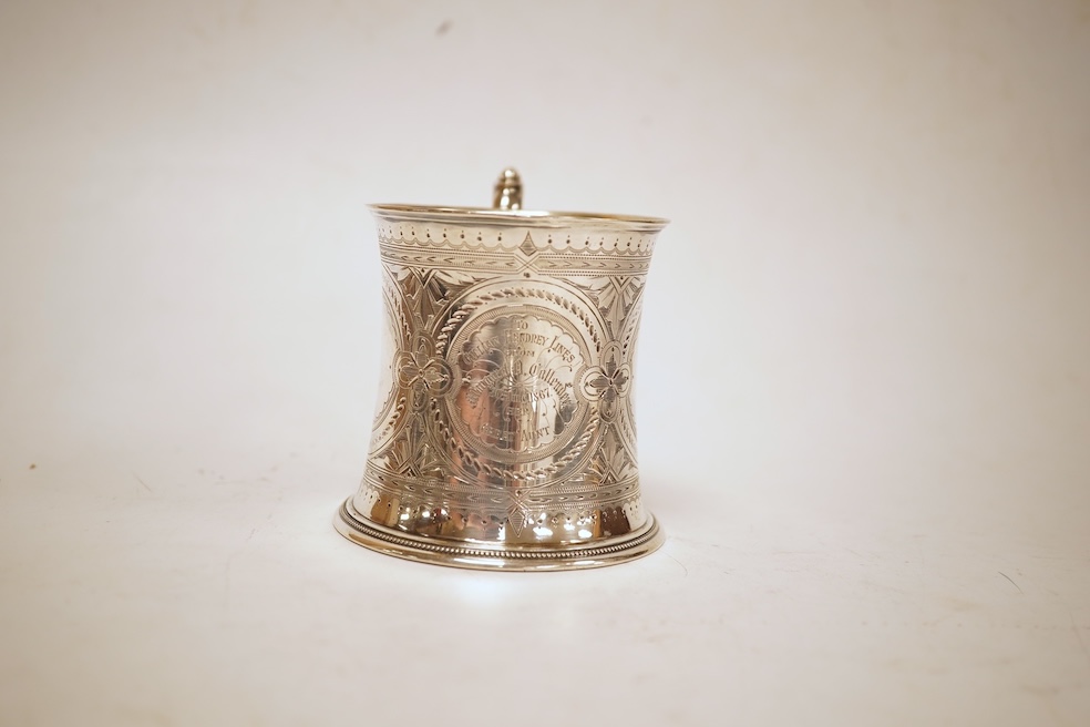 A Victorian bright cut engraved silver christening mug, of waisted form, with engraved inscription and beaded handle, Samuel Roberts & Charles Belk, Sheffield, 1867, 82mm, 5.2oz.